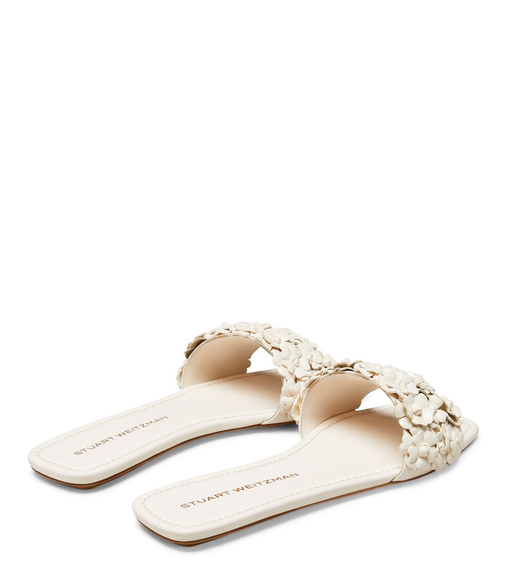 Stuart Weitzman MEADOW FLAT SLIDE en SEASHELL de Mujer | Stuart Weitzman® ÚLTIMAS EDICIONES