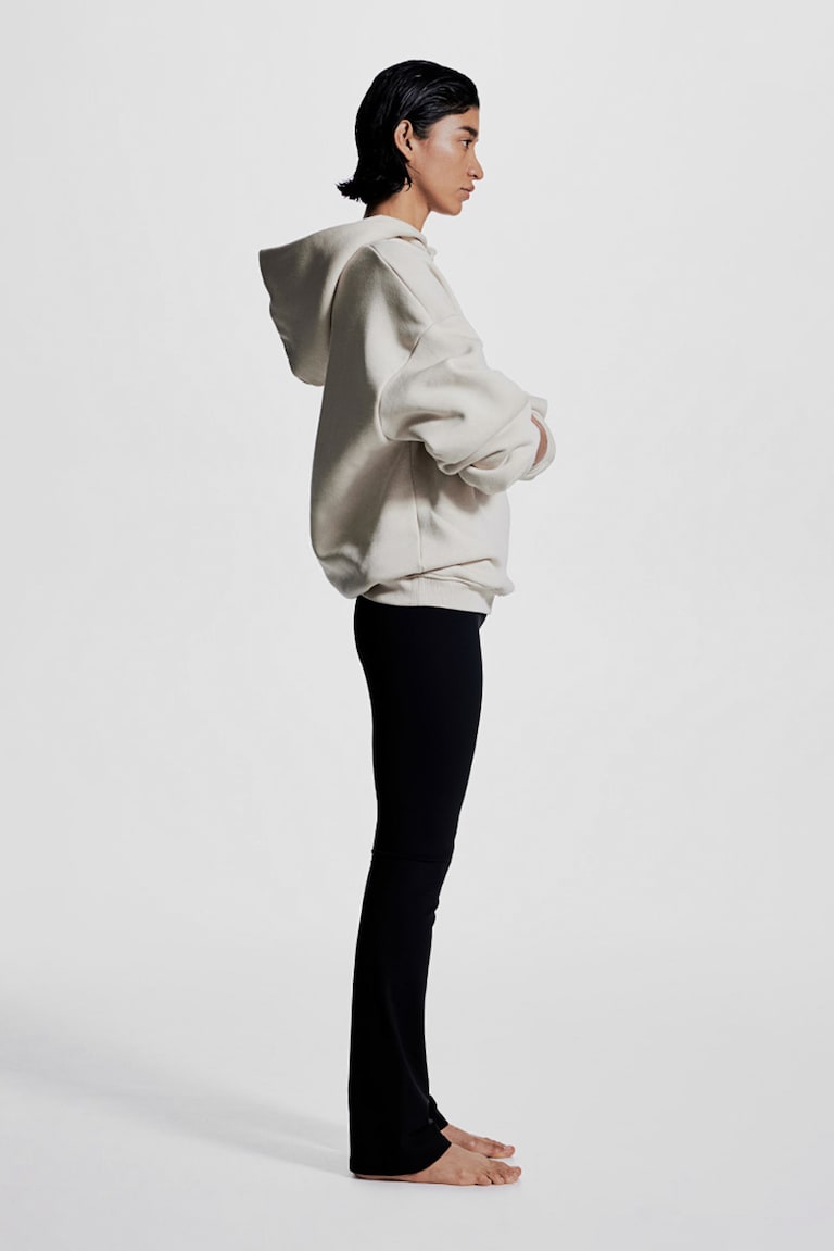 H&M Leggings de yoga acampanados con SoftMove™ Lycra® - Negro - MUJER