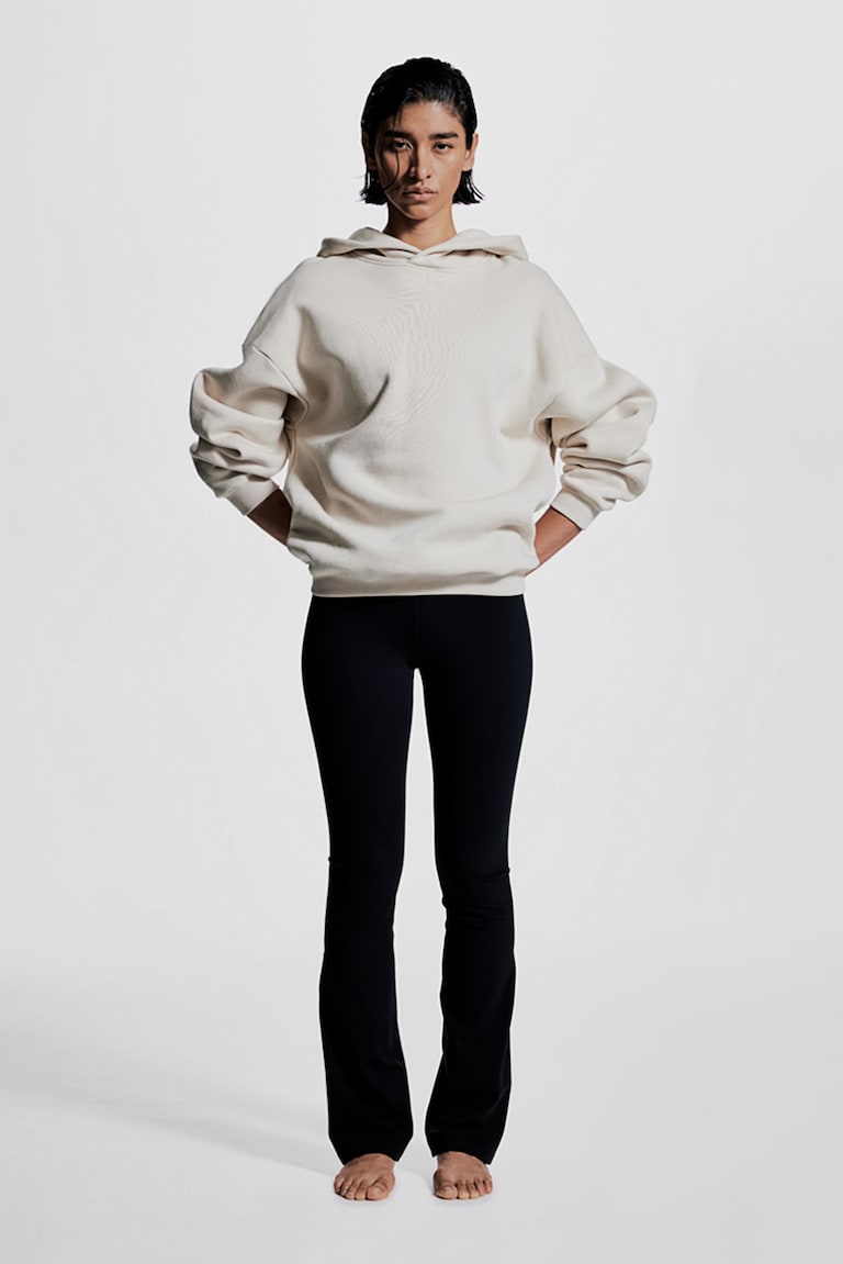 H&M Leggings de yoga acampanados con SoftMove™ Lycra® - Marrón oscuro - MUJER Promoción por tiempo limitado