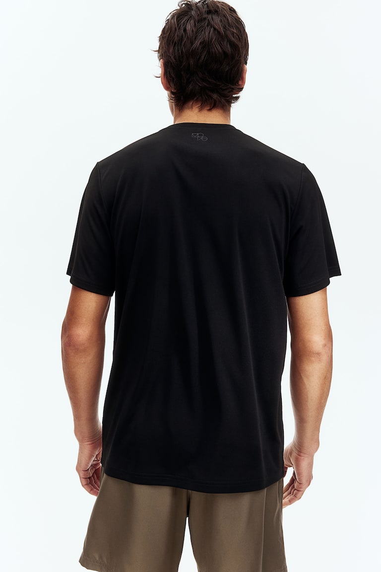 H&M Camiseta de deporte con DryMove™ Regular Fit - Turquesa - HOMBRE Precios de Black Friday